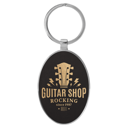 3" x 1 3/4" Laserable Leatherette/Metal Black/Gold Oval Keychain (Sold by Case of 50)