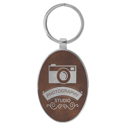 3" x 1 3/4" Laserable Leatherette/Metal Rustic/Silver Oval Keychain (Sold by Case of 50)