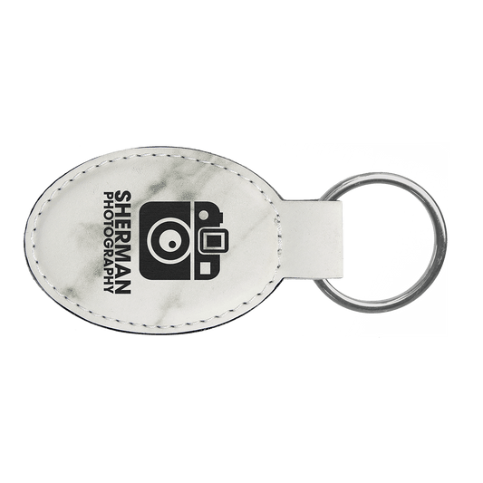 3" x 1 3/4" White Marble Laserable Leatherette Oval Keychain (Sold by Case of 50)