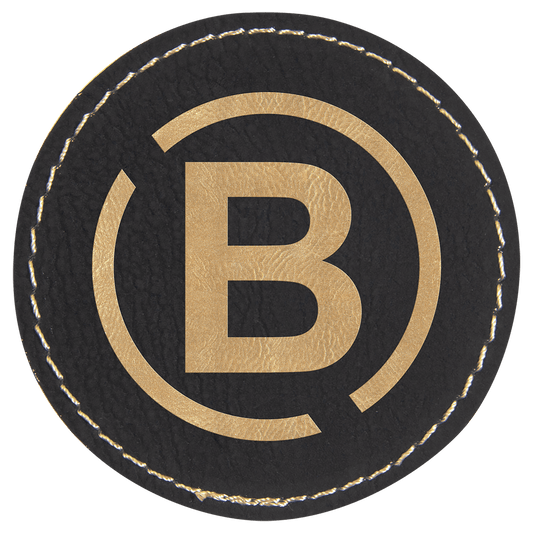 2 1/2" Round Black/Gold Laserable Leatherette Patch with Adhesive (Sold by Case of 25)