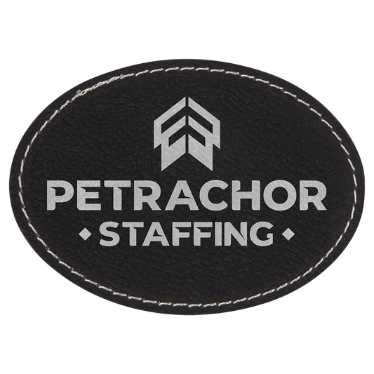 3 1/2" x 2 1/2" Oval Black/Silver Laserable Leatherette Patch with Kota Pro Adhesive (Sold by Case of 25)
